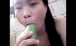 Asian masturbating at hand cucumber
