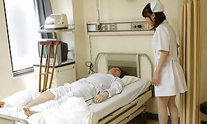 Japanese nurse Reina Wamatsu rubs dick, uncensored