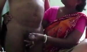Indian Aunty in a Saree Jerking Dick